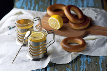 Mug of tea with bagels on a wooden background