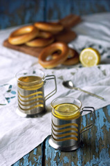 Mug of tea with bagels on a wooden background