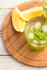 Shake with ice and tarragon on a wooden board