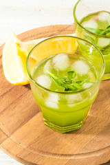 cocktail with tarragon, lemon and ice