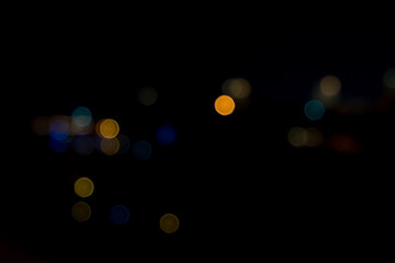 image of blurred bokeh background with colorful lights and Dark background