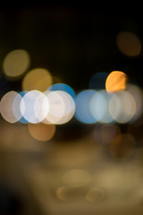 image of blurred bokeh background with colorful lights and Dark background