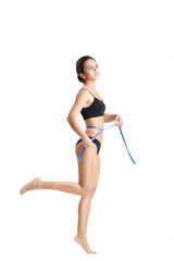woman measuring her waist by blue measure tape