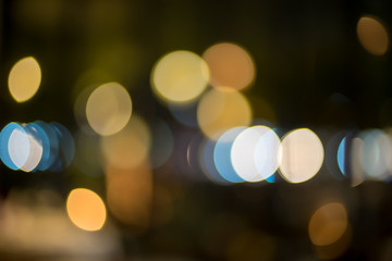 image of blurred bokeh background with colorful lights and Dark background