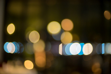 image of blurred bokeh background with colorful lights and Dark background