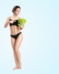 healthy woman with salad leaves