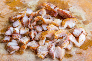 Close up slice of grill pork with knife on wood chop block in Th