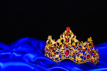 crown on a blue silk