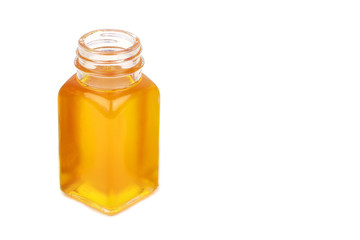 Mustard oil in bottle isolated on white