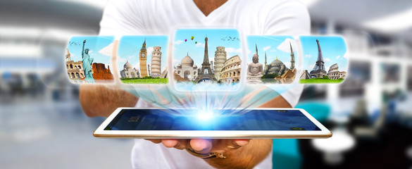 Businessman choosing his holidays between different places of th