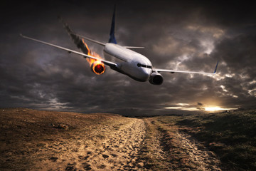 Airplane with an engine on fire