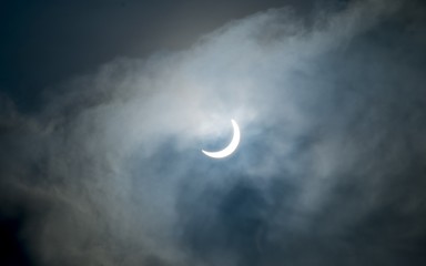 Obraz na płótnie Canvas This is a partial solar eclipse, which occurred in Indonesia, March 9, 2016. Showing the form of sun-covered moon, and formed like a crescent moon