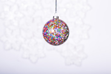 Fototapeta premium Beautiful shiny ball on a winter background