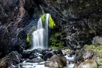 Beautiful waterfall behind the cave