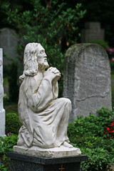 Saint statue in praying moment