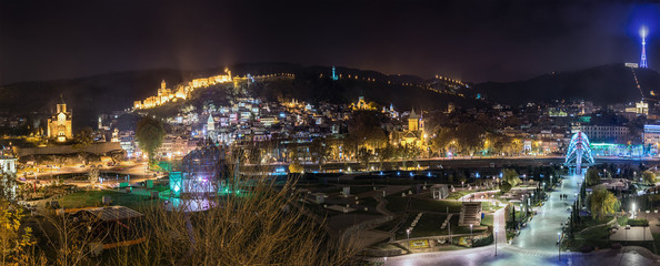Georgia, Tbilisi. November 23, 2016. Panorama of the city at night. Recreation Park Rike, TV tower, Narikala fortress and pedestrian bridge of the world.