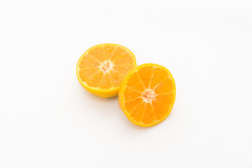 whole and half cut orange on white background