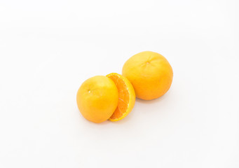 whole and half cut orange on white background