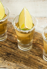 gold tequila in a glass closeup