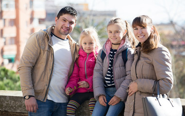 Family with two girls outdoors