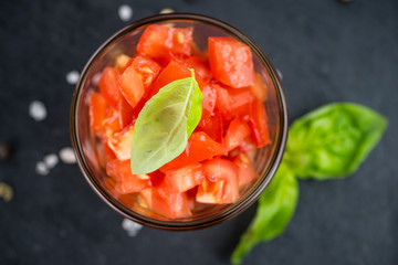 Portion of Tomatoes (diced) on a slate slab