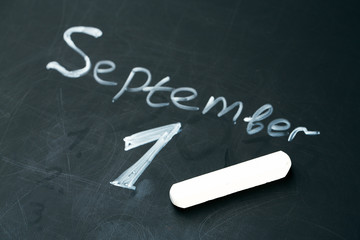 September 1 The phrase written in chalk on the blackboard.