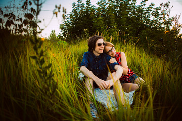 guy and the girl sitting in the grass