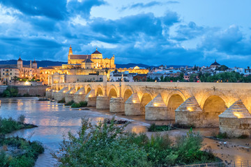 Puente Romano bridge and Mosque-Cathedral of Cordoba in the evening, Andalusia, Spain