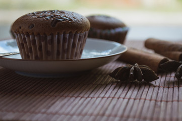 Cup cake on wood background with coffee cup.Vintage tone.Selective focus.
