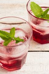 Red juice with ice and mint
