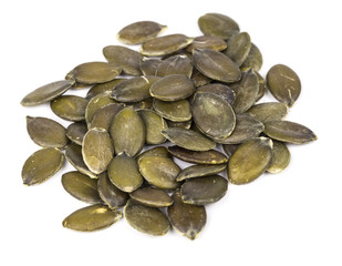 Pumpkin seeds on a white background.