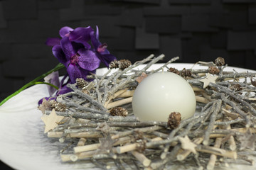 white candles decorated on a plate