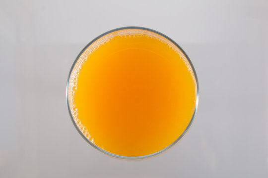 Isolated Glass Of Orange Juice Viewed From The Top