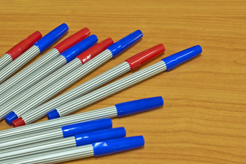 red, blue, magic pen on wood background