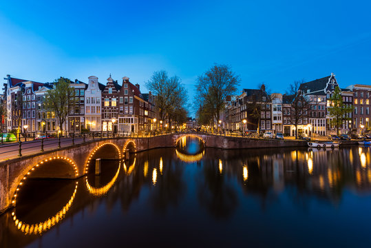 Night city view in Amsterdam, Netherlands. Canal and typical dut
