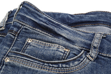 Fragment of dark blue jeans on white background
