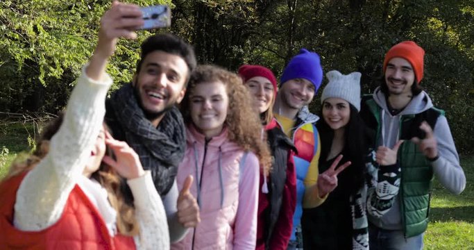 Young People Group Taking Selfie Photo On Walk In Autumn Forest, Mix Race Friends Outdoor Woods Slow Motion 60