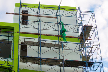Construction site with cranes on sky background