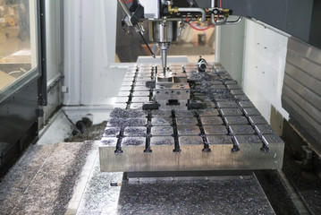 Processing part in Milling CNC machine with face mill in spindle