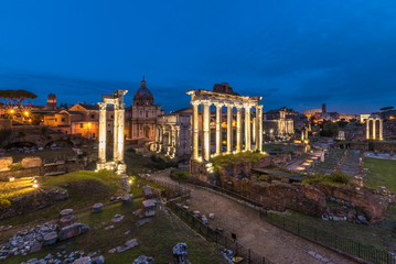 Obraz na płótnie Canvas Rome (Italy) - The archeological ruins in historic center of Rome, named Imperial Fora. Cityscape from Campidoglio and Via dei Fori Imperiali.