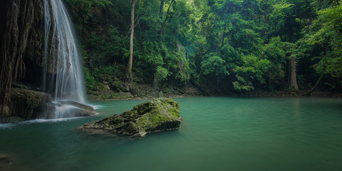 Fototapeta na wymiar Green and clean waterfall for relaxation , Erawan waterfall , Located Kanchanaburi Province , Thailand