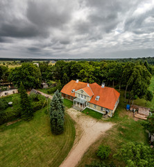 Scenic view of Varbla manor against cloudy sky