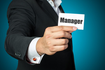 businessman holding manager card