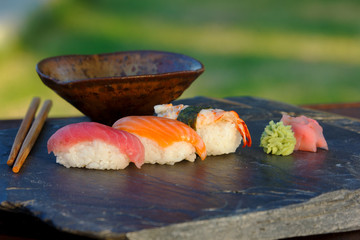 Japanese sushi on black stone outdoor