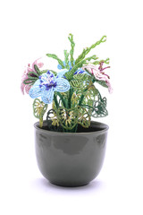 Bead flowers in a pot isolated on white