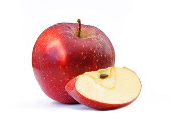 cut red apple with seeds on a white background