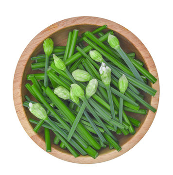 top view of sliced fresh green chinese chives in wooden bowl iso