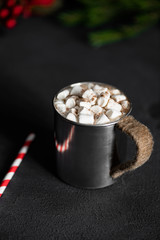Hot cacao in hipser metal cup on black table