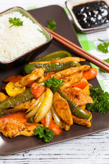 Chicken and Rice with Spicy Sesame Teriyaki Wok Sauce. Selective focus.