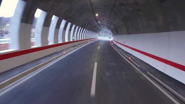 Drive through the highway gallery tunnel.